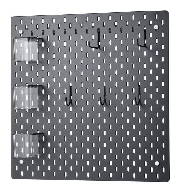SKÅDIS grey pegboard with hooks and plastic containers. Organised wall storage solution.