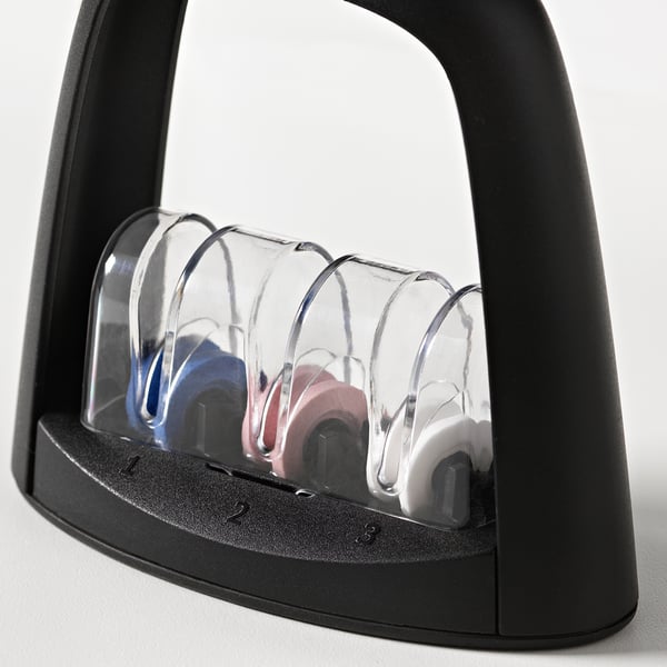 Knife sharpener with clear, curved slots for sharpness levels. Black, durable plastic handles, fine-to-coarse sharpening.