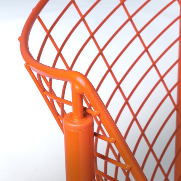 Bright orange metal chair with intricate lattice back, sturdy cylindrical legs, and sleek design focus