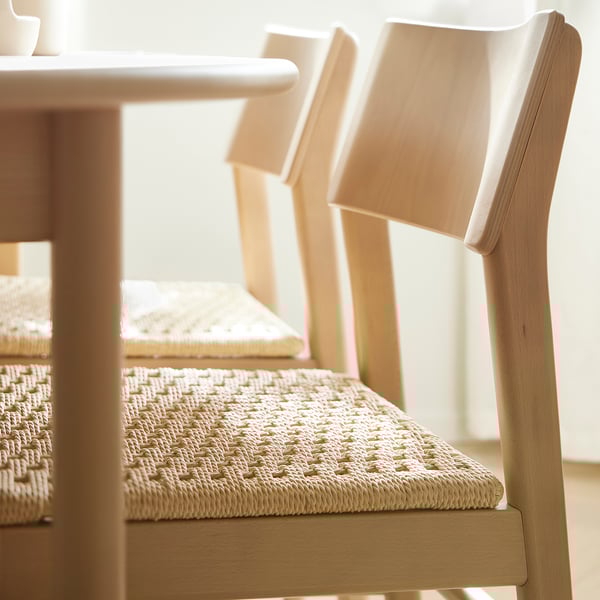 SKANSNÄS chair: modern light beige wood, woven seat. Wide backrest, comfortable & sturdy. Ideal for dining, fits under table.