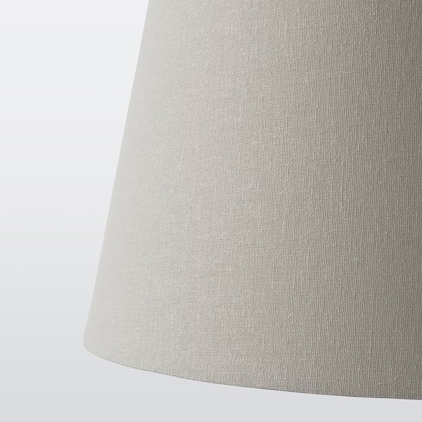 White fabric lampshade close-up, smooth texture, conical shape, illuminated from within.