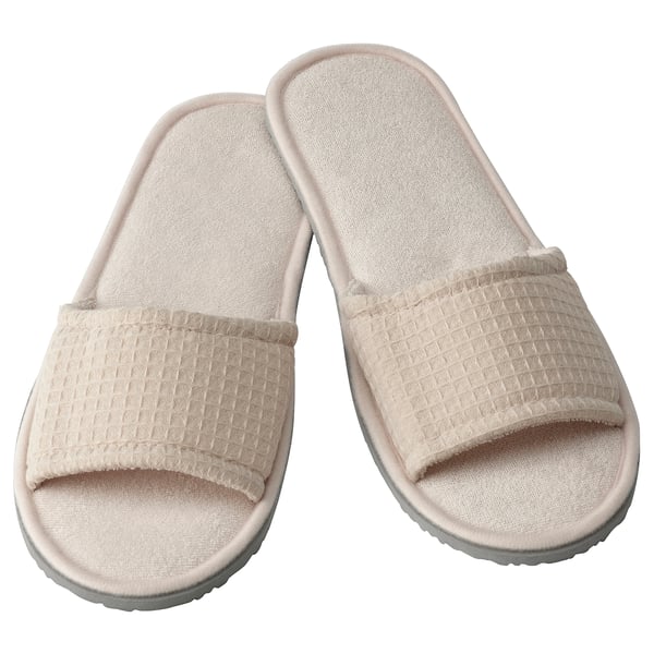 Beige SKOVELSJÖN slippers, textured fabric, open-toe, soft foam sole.