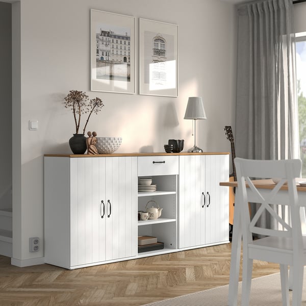 SKRUVBY sideboard in dining area with dishes and decorations.