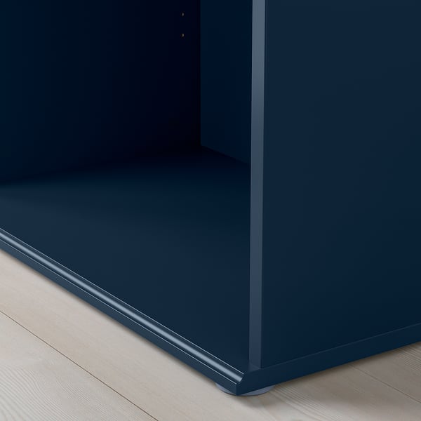 Close-up of sleek, durable blue tv bench with smooth edges and cable outlet.