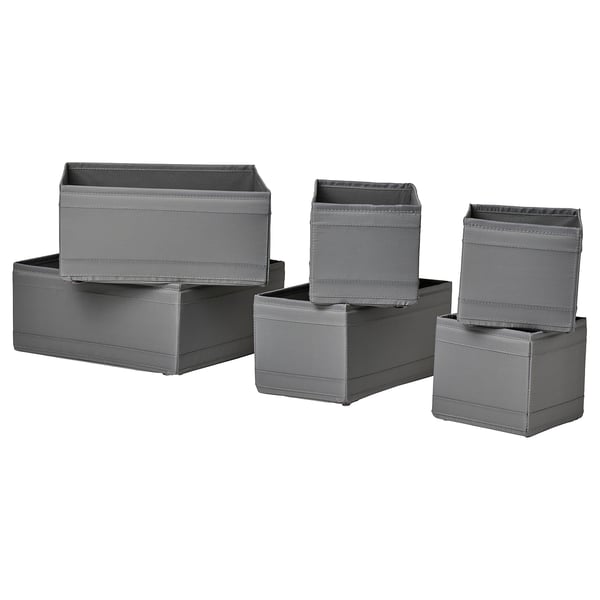 Six grey SKUBB boxes, three stacked in back, three in front, rectangular shape with mesh tops, made from recycled polyester fabric.
