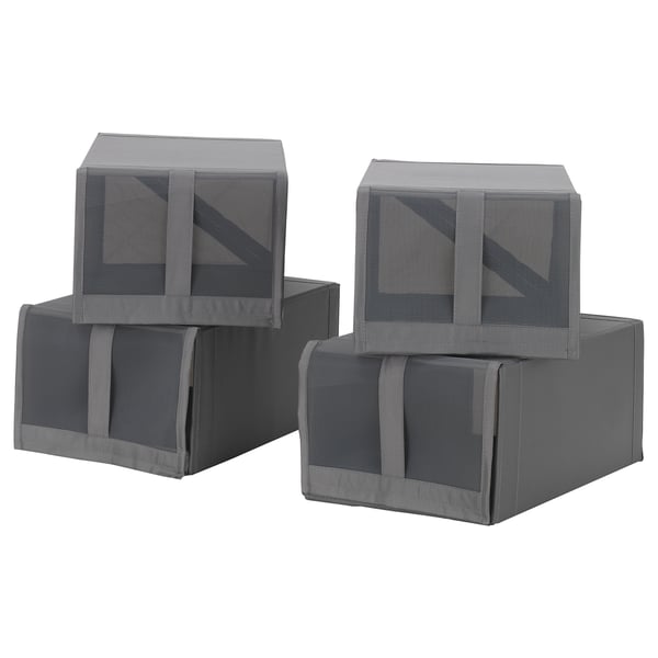Four grey fabric boxes with mesh tops, handles, and zippers, stacked neatly in a compact, rectangular arrangement.