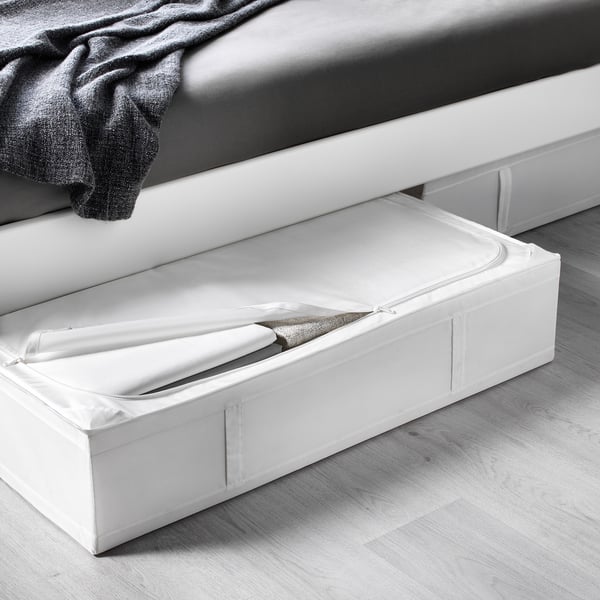 Under-bed storage box with open lid showing folded linens, ideal for seasonal storage.