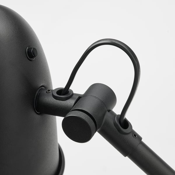 Black lamp with adjustable arm.