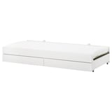 A white SLÄKT kids roll-out trundle bed with drawers for storage, featuring a modern design with a sleek, rectangular shape.