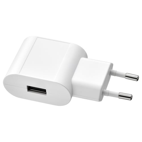 Small white usb charger, compact design, round edges.