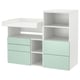 White and mint childrens storage unit with shelves and drawers, modern and functional design.