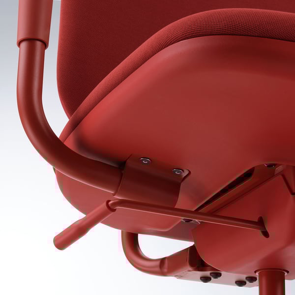 Red office chair close-up; curved armrest, adjustable tilt, smooth castors.
