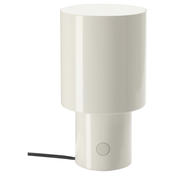 A white, cylindrical SPETSBOJ table lamp with a sleek design and a small control button on the side.