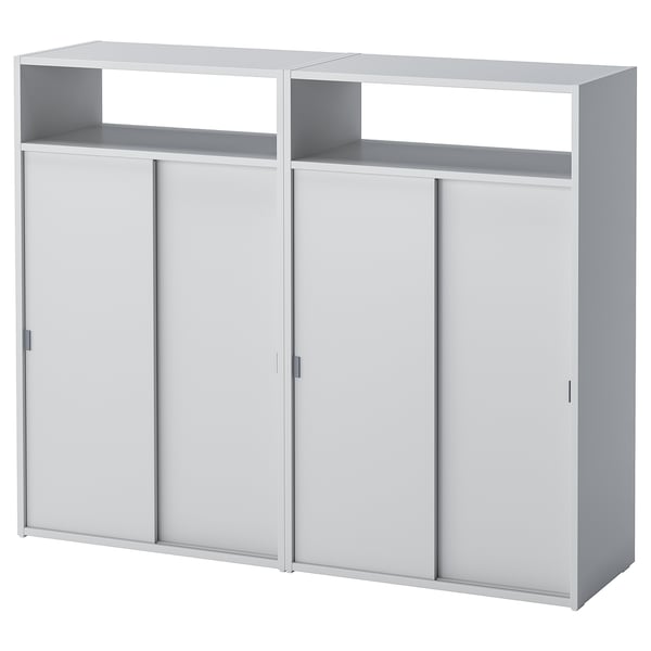 A white SPIKSMED storage unit with sliding doors and open shelves, combining open and closed storage for efficient space use.