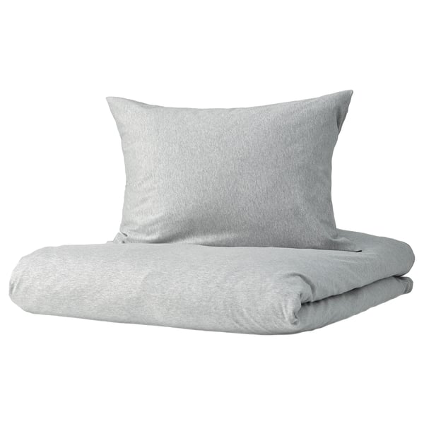 Grey SPJUTVIAL bedding set with soft, stretchy cotton jersey, including folded duvet and pillow, minimalist design.