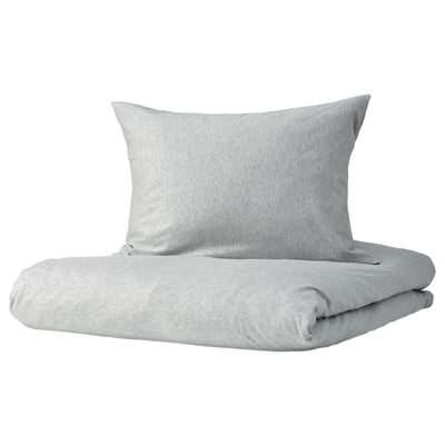 Grey SPJUTVIAL bedding set with soft, stretchy cotton jersey, including folded duvet and pillow, minimalist design.