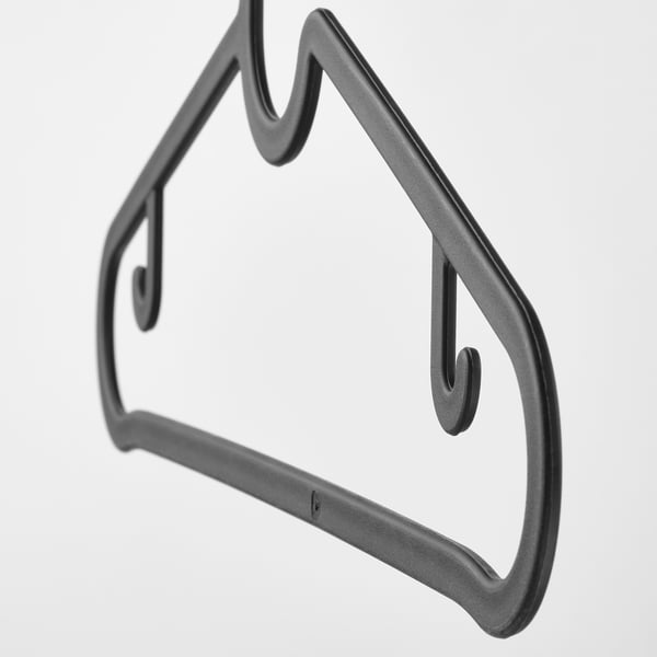 Black plastic hanger, designed for trousers or shirts, shown in close-up, highlighting durable, space-saving design.