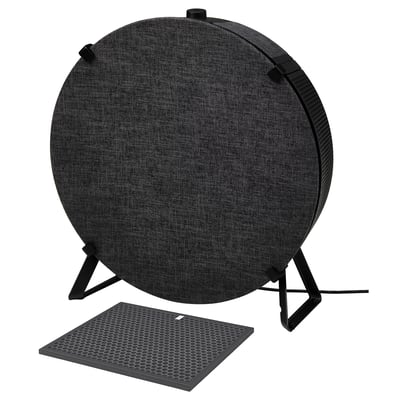 Dark gray circular air purifier on stand, with mesh filter panel in front.