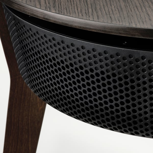 Modern side table with a sleek wood grain top and perforated metal base, part of IKEAs STARKVIND air purifier series.