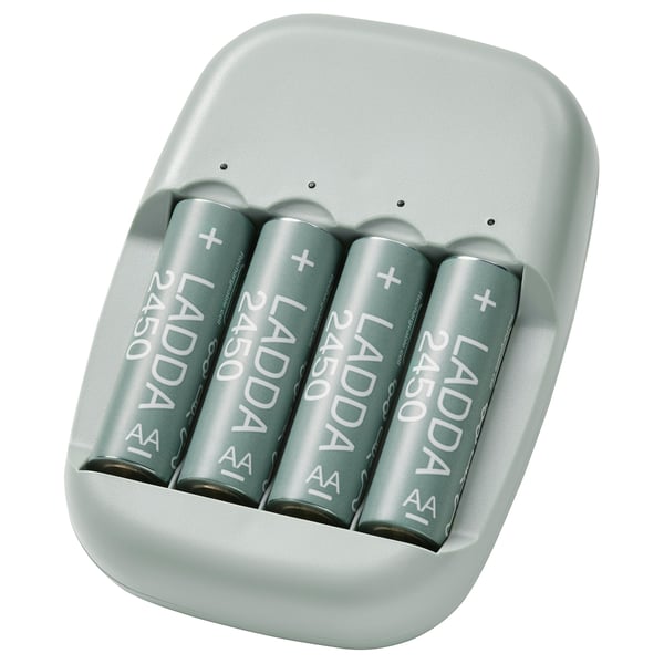 Set of 4 grey rechargeable batteries in a green silicon charger.