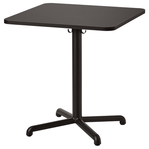 A black STENSELE square café table. It a sleek design with a sturdy metal base and a laminate tabletop, perfect for small spaces and casual use.