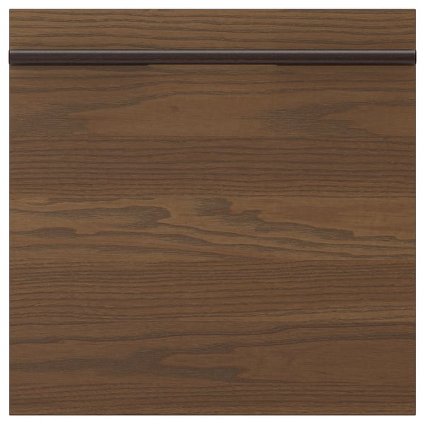 A dark brown wooden drawer front from the STENSTA series, featuring a natural wood grain pattern and sleek, horizontal handles.