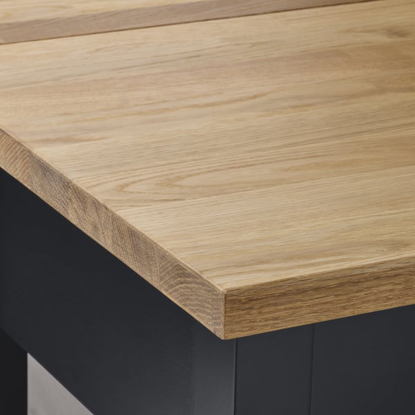 STENSTORP trolley with sleek, natural oak top and sturdy black base, showcasing premium craftsmanship.