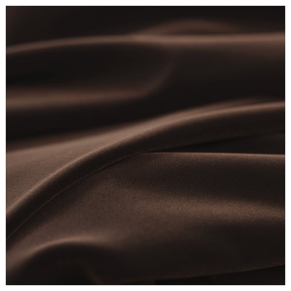 Dark brown fabric close-up, showcasing smooth texture and intricate weave, highlighting quality and detail.