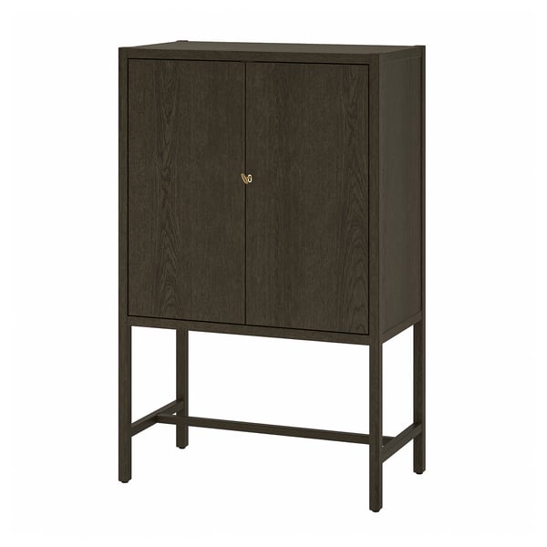 STOCKHOLM 2025 cabinet, dark brown, wooden with brass key, rectangular, two doors, standing on four metal legs.