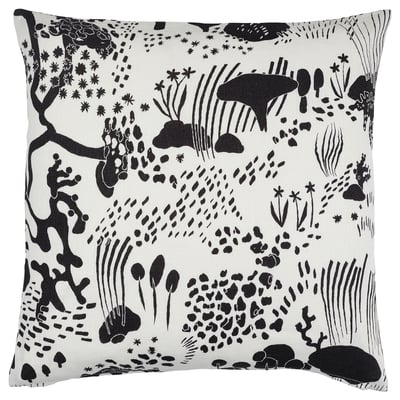 IKEAs white and black STOCKHOLM 2025 linen cushion with nature-inspired forest design, zip closure.