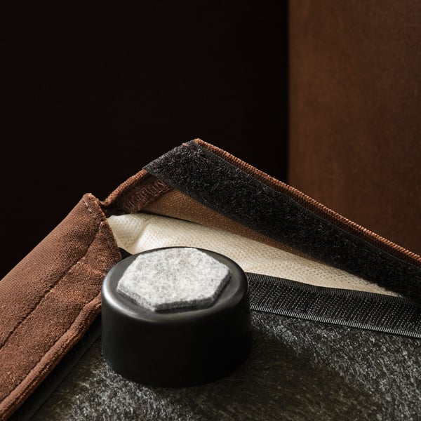 Closeup of velvet fabric with zip and foam, showcasing quality craftsmanship and materials.