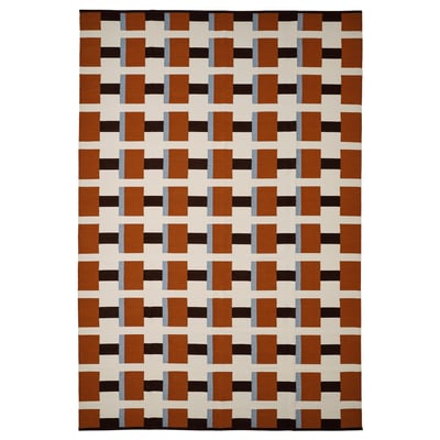 STOCKHOLM 2025 rug: brown, black, beige squares on cream. Handwoven wool and cotton, rectangular.