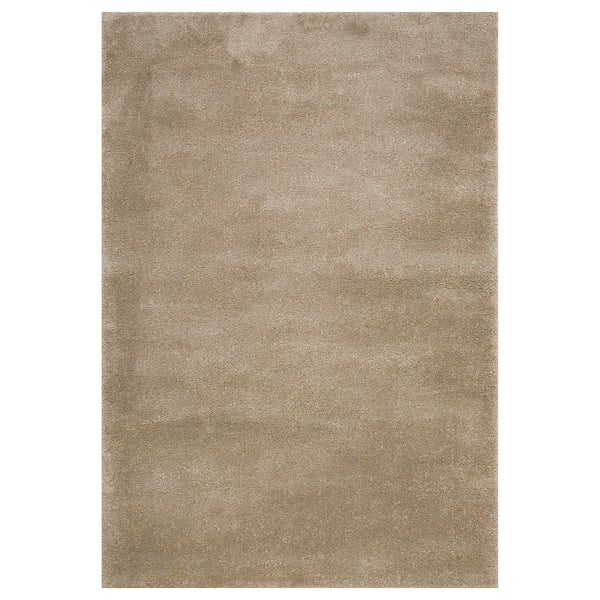 A beige STOENSE rug. Its rectangular, soft, with a slightly shiny surface. Ideal for large or small rooms, it dampens sound and feels cosy.