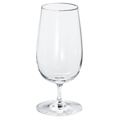 Single empty, clear wine glass with long stem and wide bowl, standing upright.