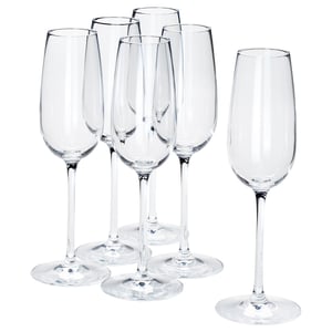 Six clear STORSINT crystal wine glasses, five grouped, one separate. Long stems, broad bowls, shiny, elegant design.