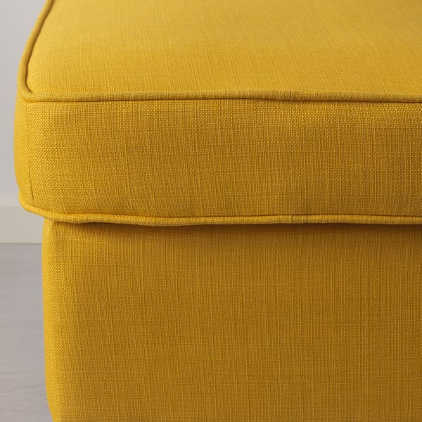 Bright yellow ottoman, showing plush, well-crafted upholstery. Comfortable, inviting texture with visible stitching detail.