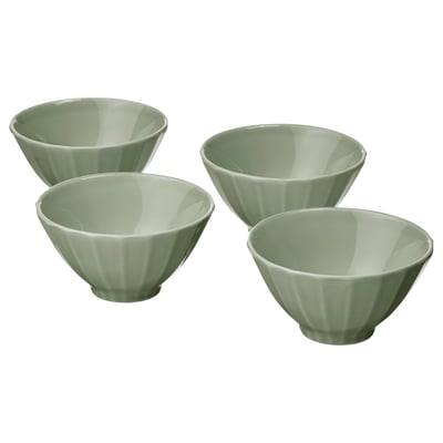 Four light green ceramic bowls with vertical ridged design displayed together.
