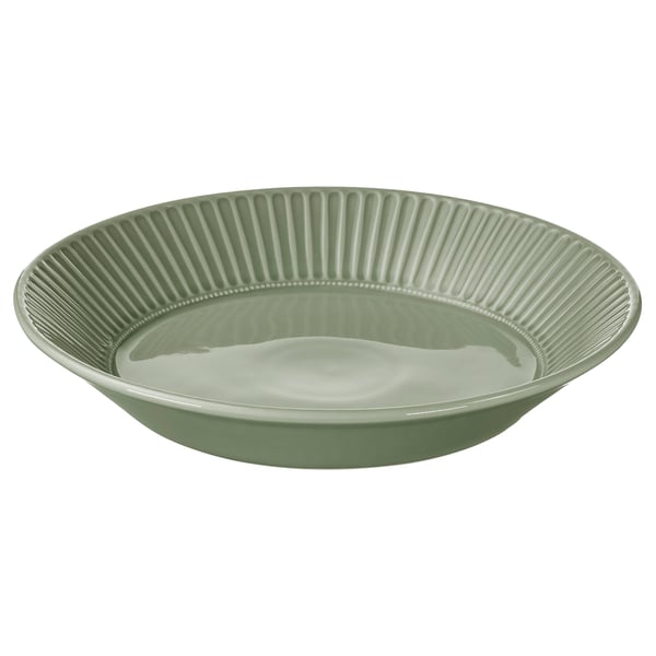 Green ceramic bowl with vertical grooves, smooth interior, round shape.