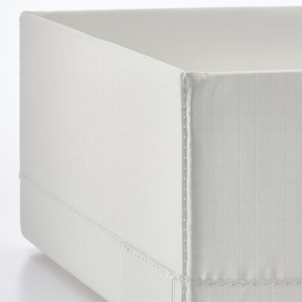 Closed white fabric storage box with clean stitching.