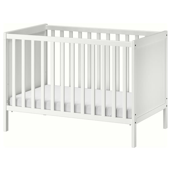 A white wooden SUNDVIK crib with adjustable mattress height and removable side panel, designed for baby safety and comfort.