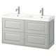 Modern dual vanity in light grey with double sinks and chrome faucets.