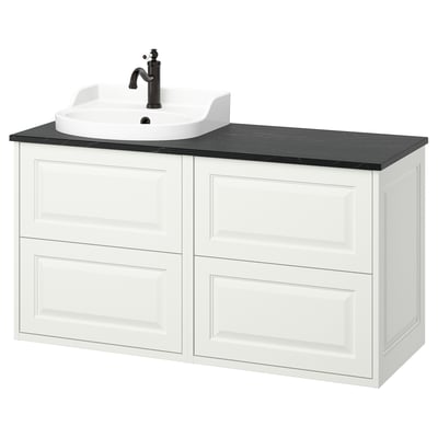A white TÄNNFORSEN bathroom vanity with black countertop and sink. It classic design with beveled panels and offers ample storage.