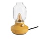 Mustard yellow TÄRNABY lamp with glass shade and ceramic base.