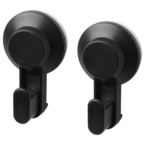 Black TISKEN hooks, circular design, strong suction cups, wall-mountable, plastic material.