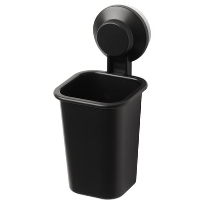 Black TISKEN wall-mounted toothbrush holder, round top, rectangular body, suction-cup attachment.