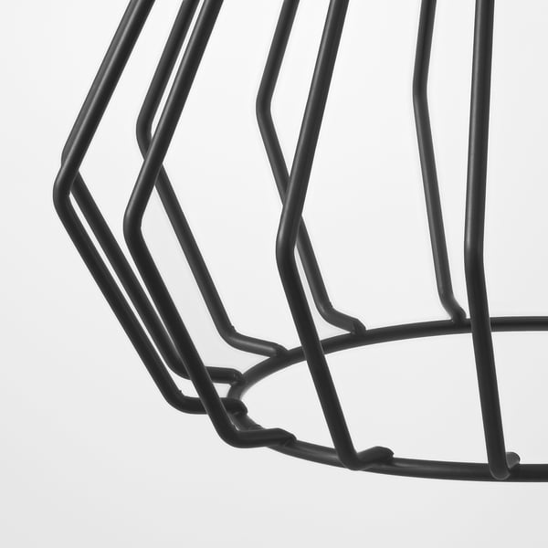 Black metal wireframe of a minimalist lampshade, showcasing intricate geometric design.