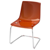 TOBIAS orange chair, modern design, transparent, chrome legs, curved shape.
