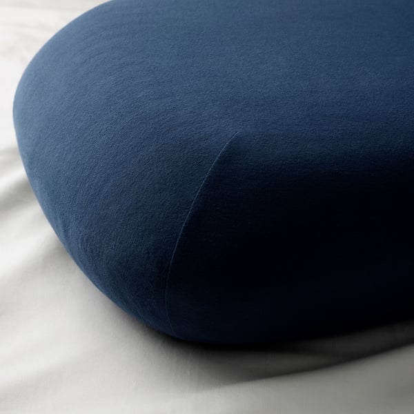 Round dark blue cushion, soft fabric, smooth texture.
