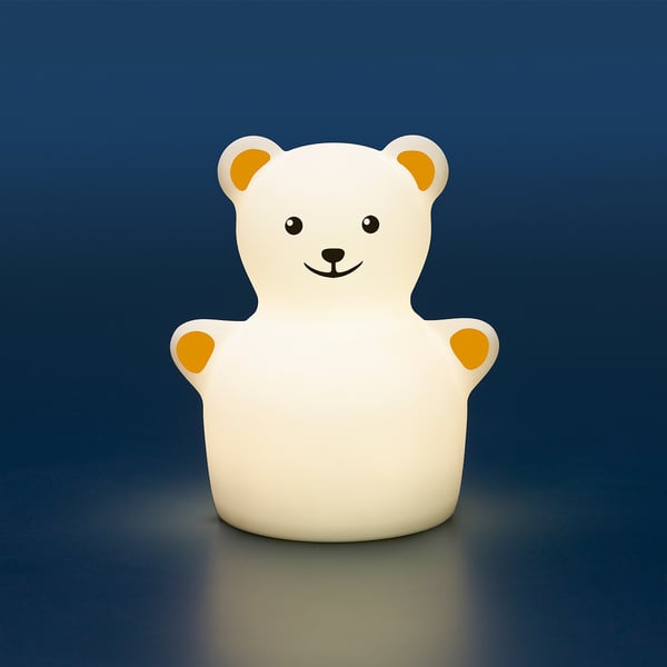 A beige teddy bear night light with orange paw pads, emitting a warm glow. It can change colours and has a timer for safety.