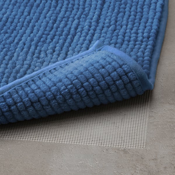Blue bath mat with textured, non-slip surface for safety and comfort.
